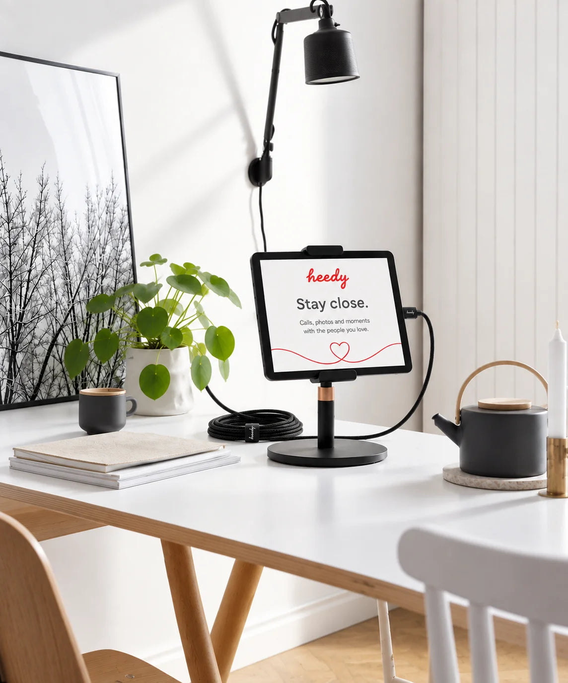 Heedy adjustable tablet stand showing 360-degree rotation and up to 135-degree viewing-angle adjustment in landscape and portrait positions.
