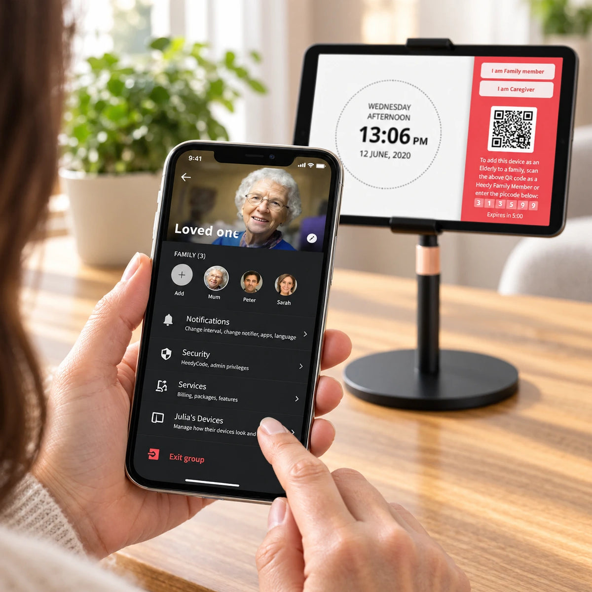 Family member using the Heedy app to connect a loved one’s tablet and personalize family, notification and device settings.