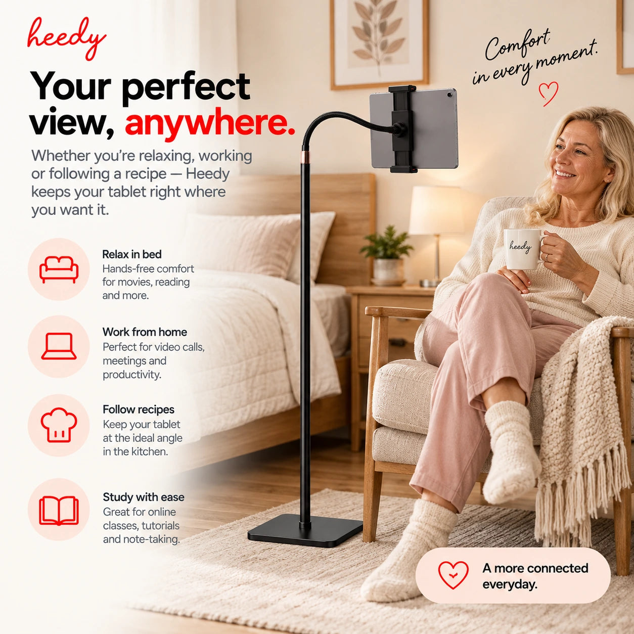 Heedy floor tablet stand with flexible arm positioned beside a chair for comfortable hands-free tablet use at home.