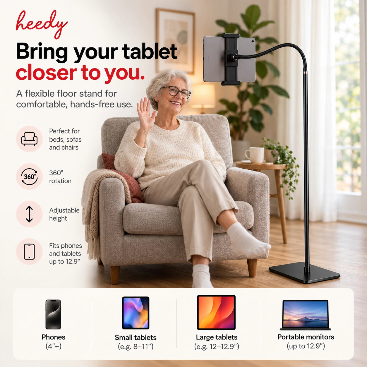 Heedy floor tablet stand beside an older woman in an armchair, showing hands-free tablet use, adjustable positioning and 360-degree rotation.