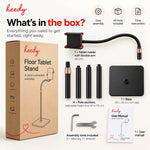 Heedy floor tablet stand package contents showing flexible tablet holder, pole sections, non-slip base, assembly tools, user manual and product box.